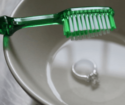 cleaning engagement ring with toothbrush