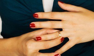 Woman Taking off Wedding Ring, Divorce