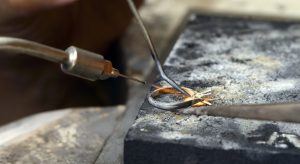 Ring Band Being Moulded In Jewellers Workshop